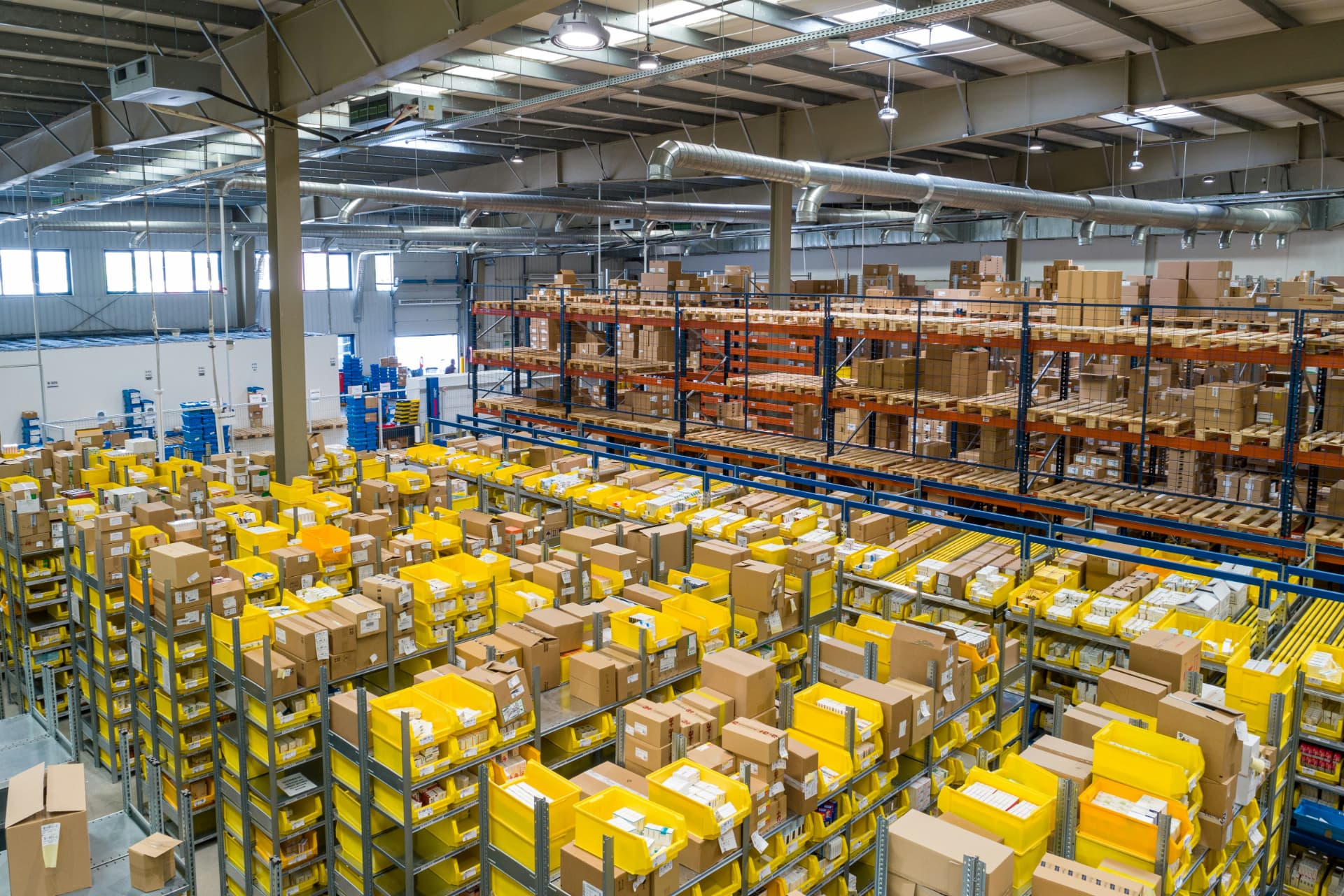 Biowell pharmaceutical distribution warehouse with stocked shelves and pallet racking
